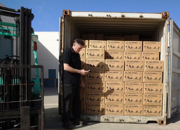 Peter Maher Packing Another Container Load Of Liquid Intelligence 115 Super Waterless Coolant To China - October 2014