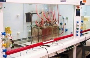 The corrosion inhibitors in Liquid Intelligence 115 under ASTM D1384 glassware corrosion testing in a laboratory fume cupboard