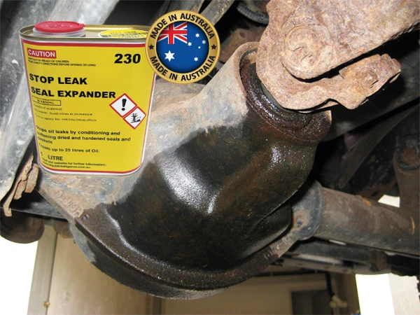 A can of Liquid Intelligence 230 in front of an oily differential