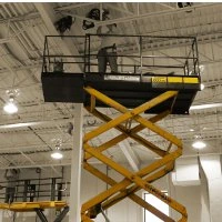 A scissor lift platform raised inside a building
