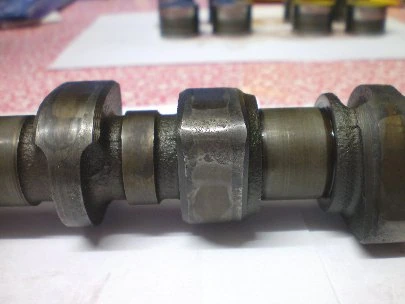 A camshaft with scuffed, worn lobes