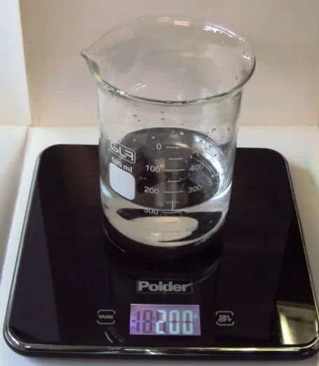 A beaker of 200ml of water on digital scales