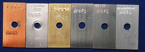 The six metal test coupons after the test: copper, solder, brass, steel, cast iron and cast aluminium