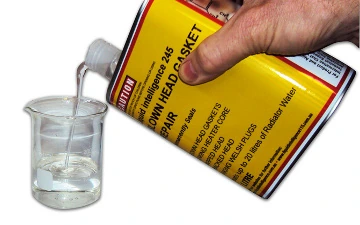 Clear Liquid Intelligence 245 being poured from the can into a glass beaker