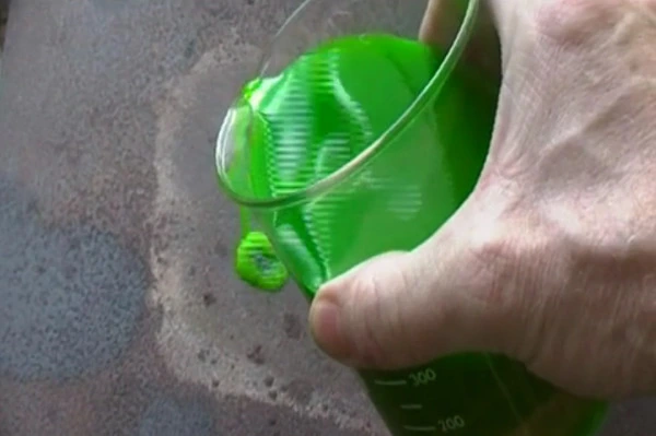 Ordinary green coolant being poured onto the hotplate