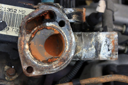 Before: the thermostat housing